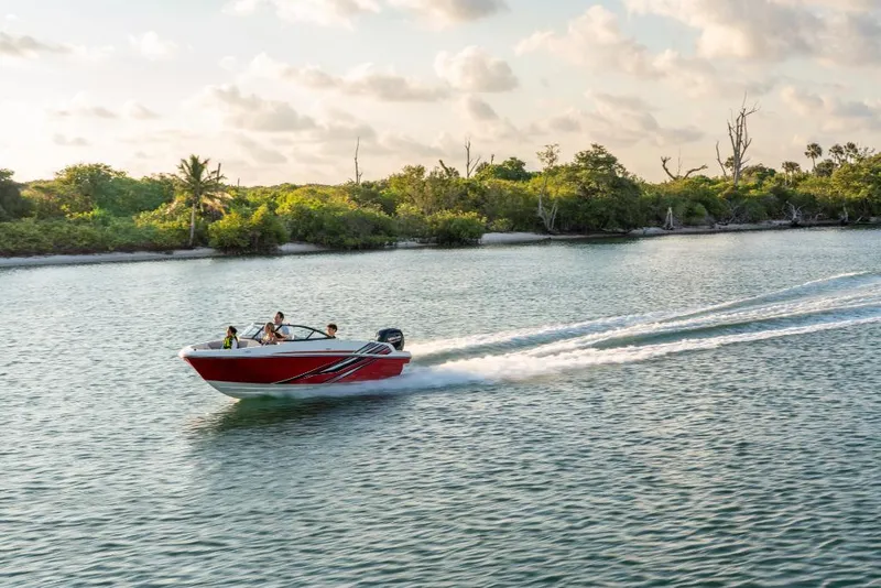Slide: The Image of 2023 Bayliner VR4 Outboard boat cruising on a scenic waterway. - 16