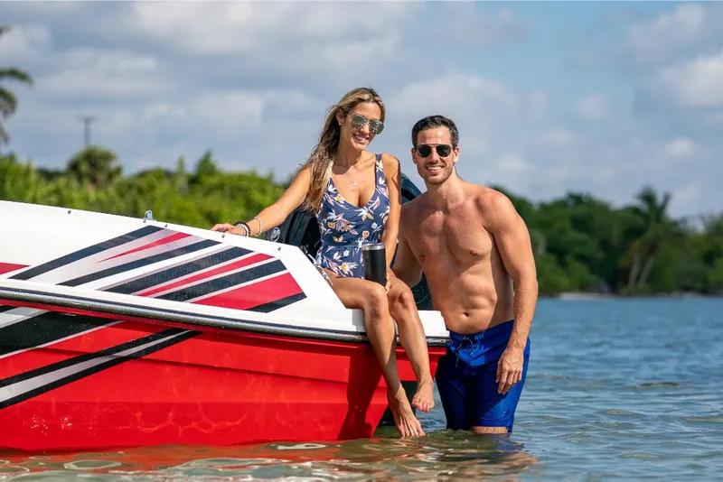 Slide: The Image of Couple enjoying water near 2023 Bayliner VR4 Outboard boat on a sunny day. - 26