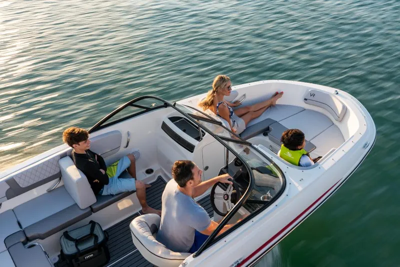 Slide: The Image of 2023 Bayliner VR4 Outboard boat with family enjoying a sunny day on the water. - 6