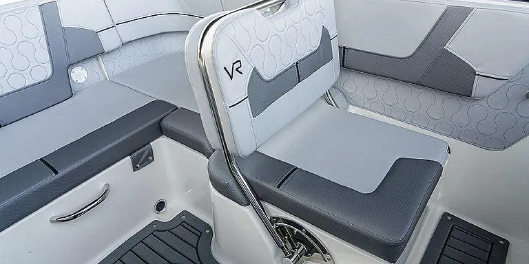 Slide: The Image of 2023 Bayliner VR5 Outboard boat interior with grey seating and modern design. - 5