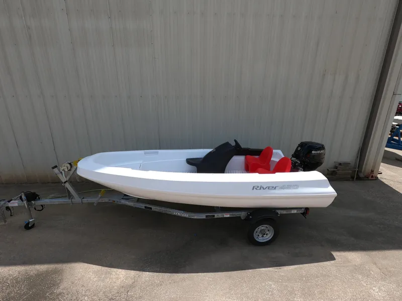 Slide: The Image of 2022 River Boats 420 on trailer, white color. - 1