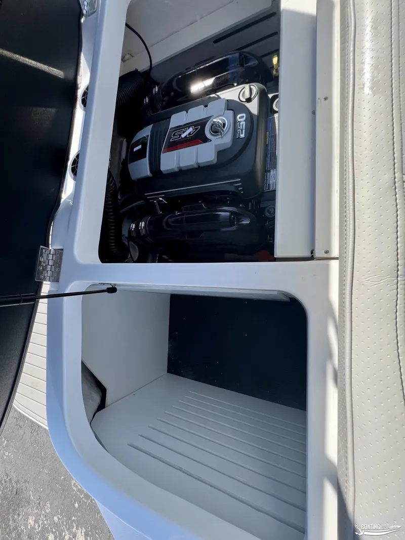 Slide: The Image of 2023 Sea Ray SPX 210 boat engine compartment, showcasing powerful motor design. - 10