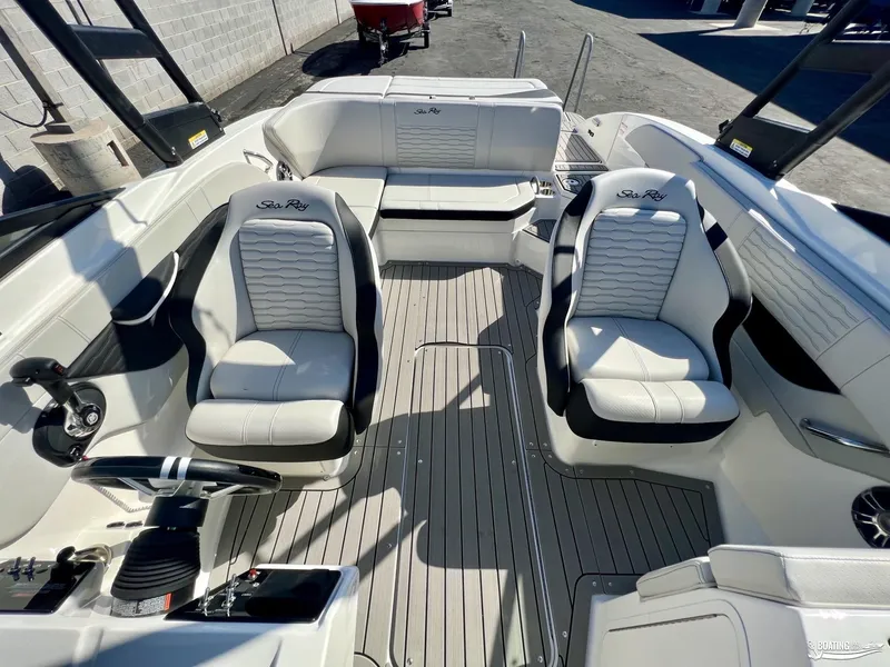 Slide: The Image of 2023 Sea Ray SPX 210 boat interior with stylish seating and modern design. - 7