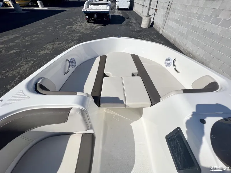 Slide: The Image of 2023 Bayliner E18 boat interior with spacious seating and modern design. - 5