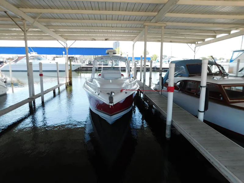 Slide: The Image of 2007 Donzi 38 ZFX boat docked in marina, covered slip. - 3