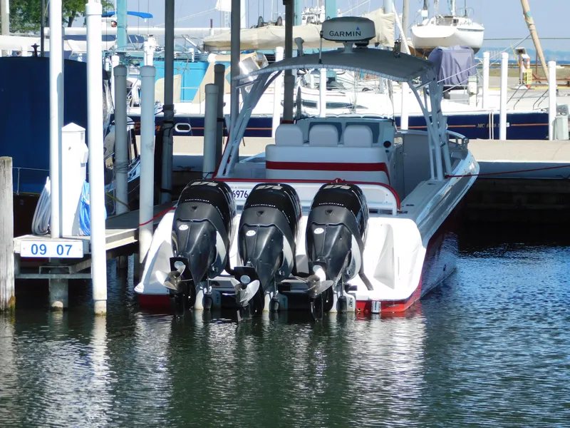 Slide: The Image of 2007 Donzi 38 ZFX boat with three outboard motors in harbor. - 5