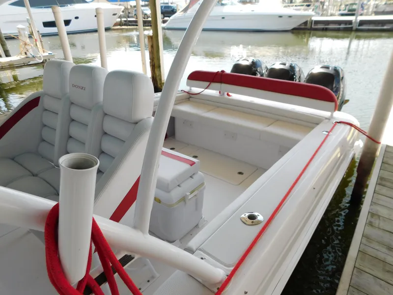Slide: The Image of 2007 Donzi 38 ZFX boat docked with red accents. - 8