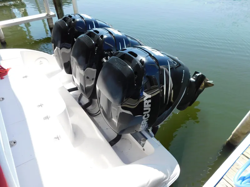 Slide: The Image of Three Mercury outboard engines on a 2007 Donzi 38 ZFX boat. - 9