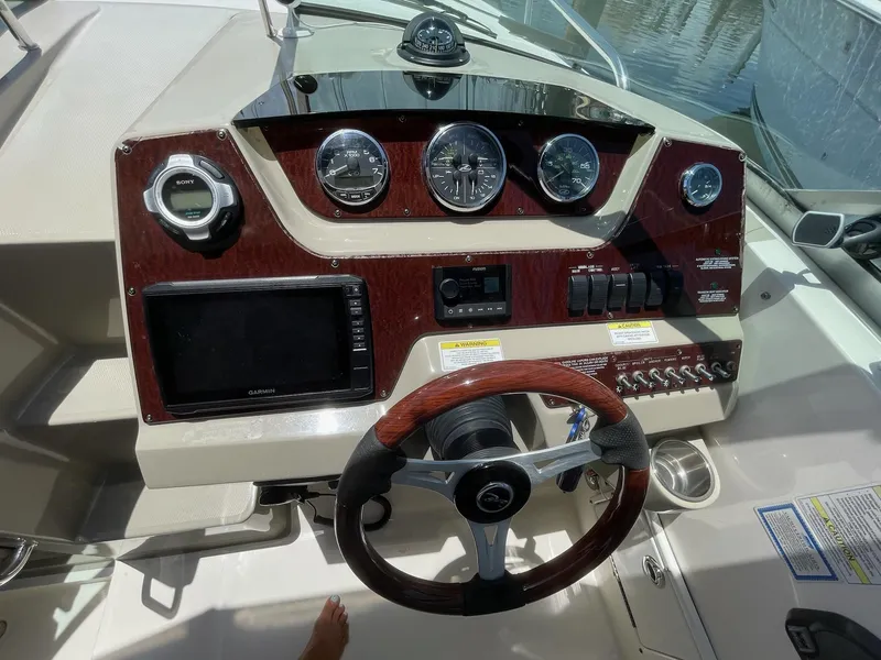 Slide: The Image of Dashboard of a 2011 Sea Ray Sundancer 280 boat. - 21