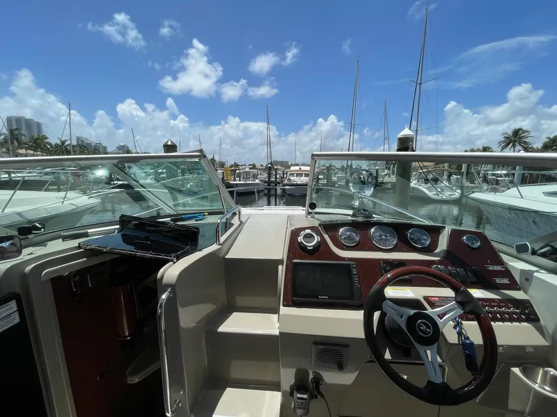 Slide: The Image of Cockpit of 2011 Sea Ray Sundancer 280 overlooking marina. - 23