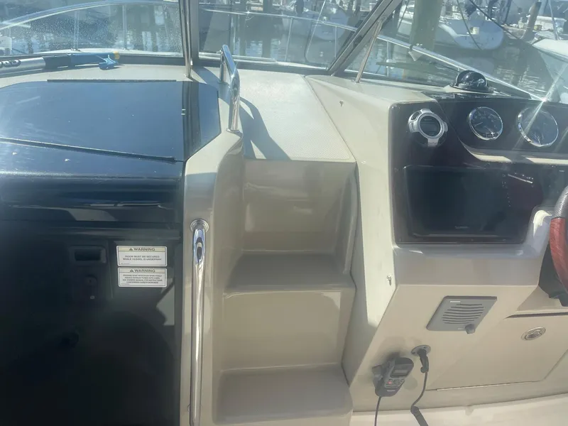 Slide: The Image of 2011 Sea Ray Sundancer 280 boat interior dashboard view. - 24
