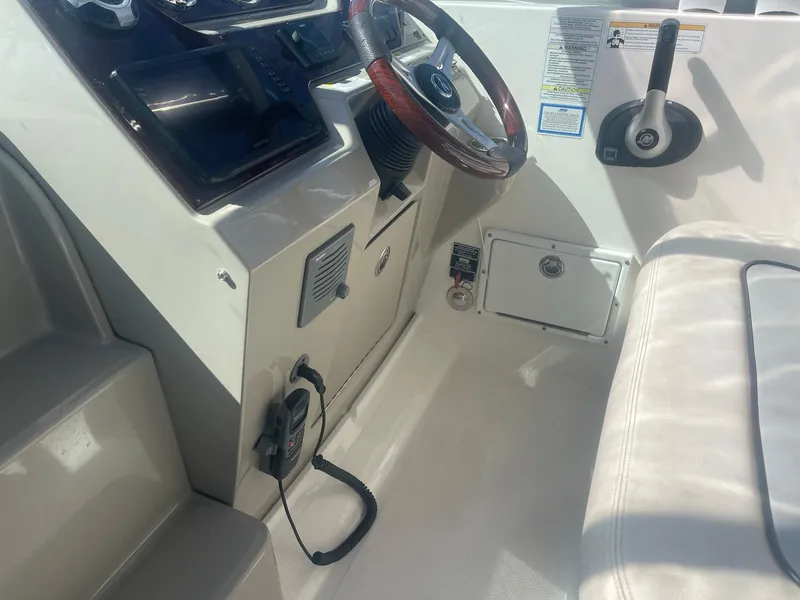 Slide: The Image of Interior view of 2011 Sea Ray Sundancer 280 cockpit. - 26