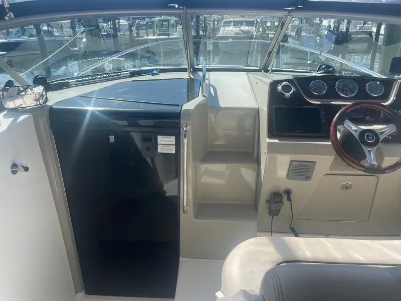 Slide: The Image of Interior of 2011 Sea Ray Sundancer 280 with helm station. - 27