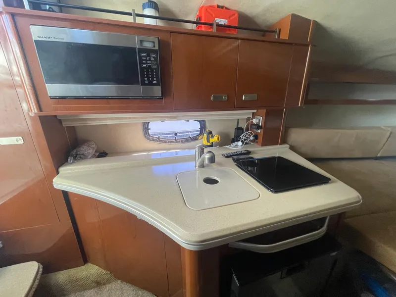 Slide: The Image of Galley in a 2011 Sea Ray Sundancer 280 yacht. - 41