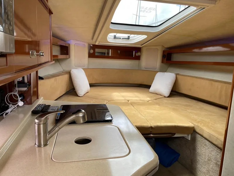 Slide: The Image of Interior of a 2011 Sea Ray Sundancer 280 yacht with cozy cabin. - 42