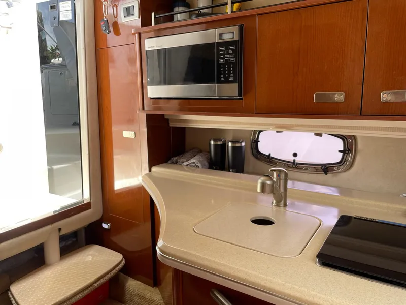 Slide: The Image of Interior of 2011 Sea Ray Sundancer 280 yacht kitchen. - 44