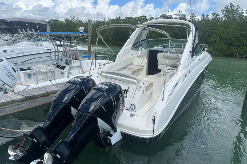Slide: The Image of 2011 Sea Ray Sundancer 280 docked with twin Mercury outboard engines. - 55