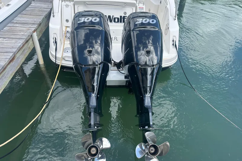 Slide: The Image of 2011 Sea Ray Sundancer 280 with twin 300 horsepower outboard engines docked in water. - 56