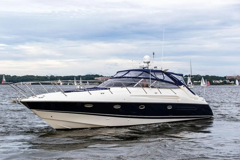 Slide: The Image of 1999 Sunseeker Camargue yacht with $250k in upgrades cruising on water. - 0