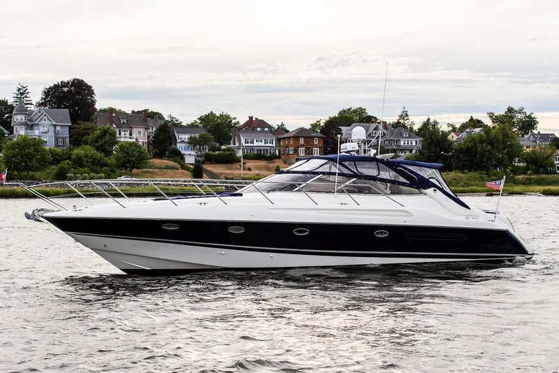 Slide: The Image of 1999 Sunseeker Camargue yacht with $250k in upgrades cruising on water. - 1