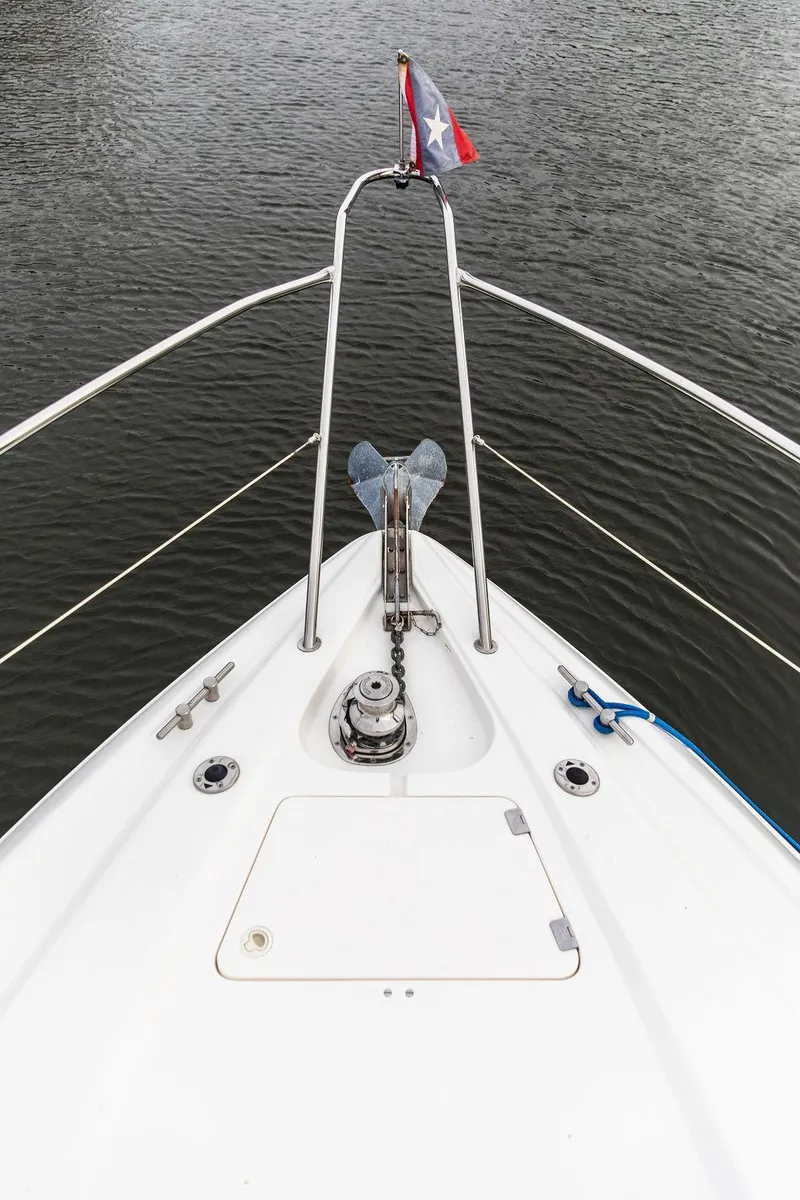 Slide: The Image of Bow of 1999 Sunseeker Camargue yacht with anchor and flag. - 10