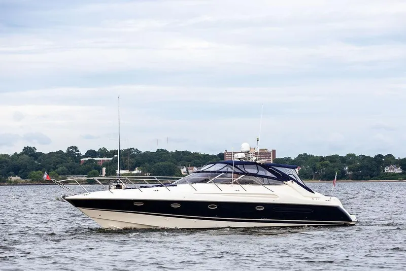 Slide: The Image of 1999 Sunseeker Camargue yacht with $250k in upgrades cruising on water. - 13