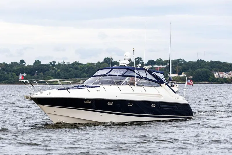 Slide: The Image of 1999 Sunseeker Camargue yacht with $250k in upgrades cruising on a lake. - 14