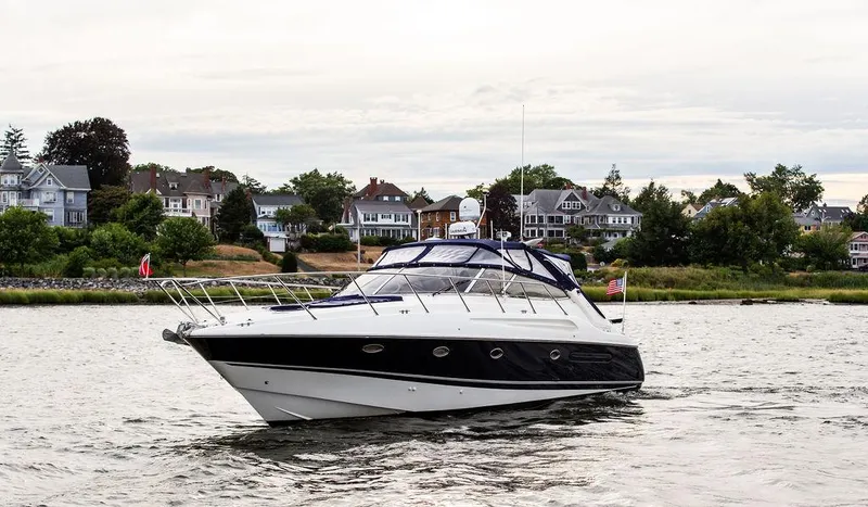 Slide: The Image of 1999 Sunseeker Camargue yacht with $250k in upgrades on a scenic waterway. - 15