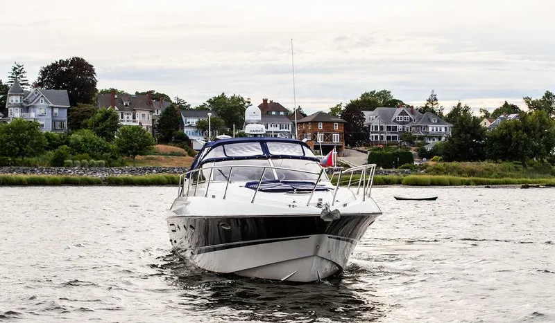 Slide: The Image of 1999 Sunseeker Camargue yacht with $250k in upgrades on a scenic waterfront. - 16