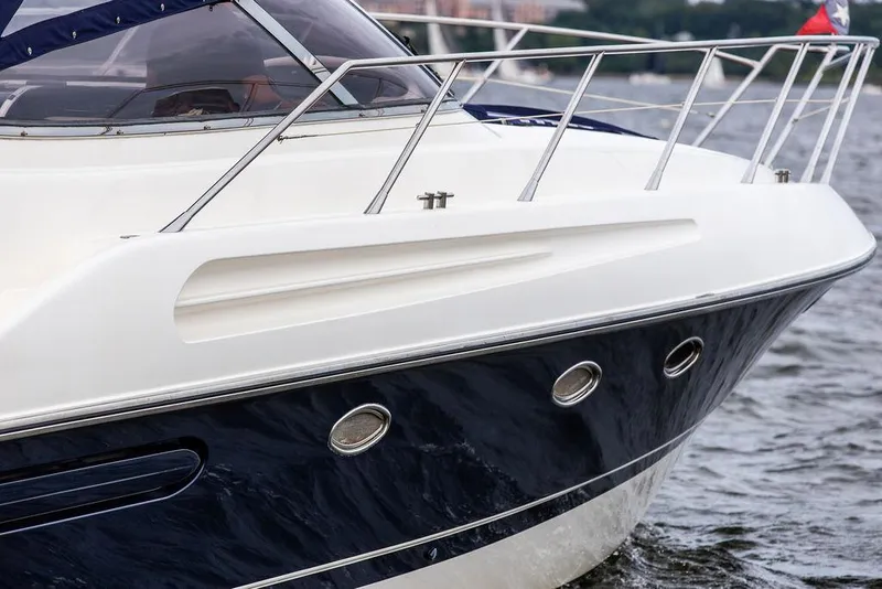 Slide: The Image of 1999 Sunseeker Camargue yacht with $250k in upgrades, sleek design on water. - 18