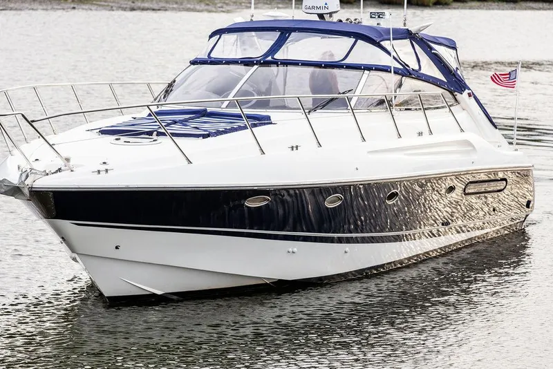 Slide: The Image of 1999 Sunseeker Camargue yacht with $250k in upgrades, cruising on water. - 20