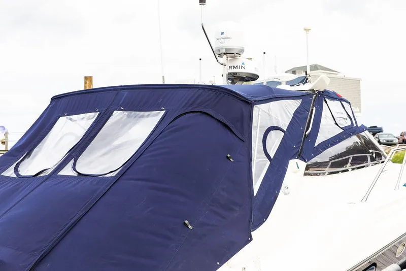 Slide: The Image of 1999 Sunseeker Carmargue yacht with $250k in upgrades, featuring a blue canvas cover. - 22