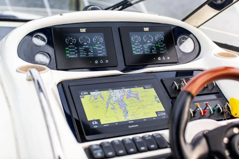 Slide: The Image of 1999 Sunseeker Camargue yacht helm with upgraded navigation and control systems. - 30