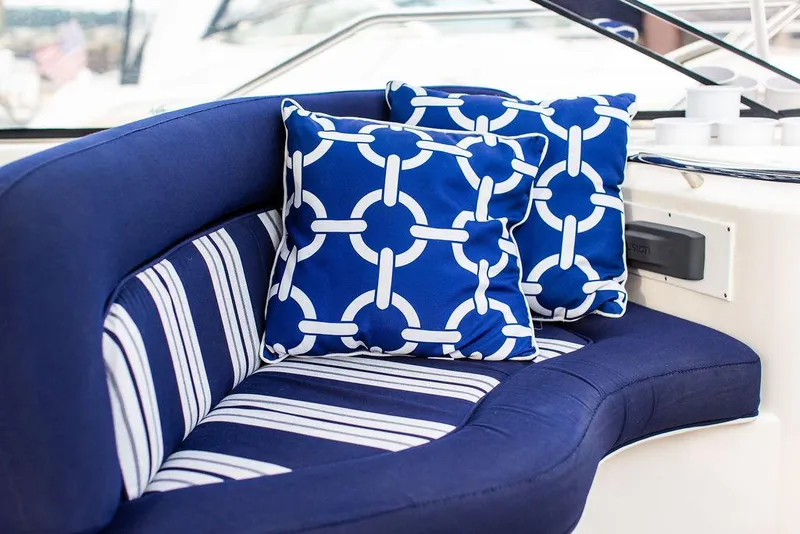 Slide: The Image of Blue and white seating area on 1999 Sunseeker Camargue yacht with nautical-themed cushions. - 40