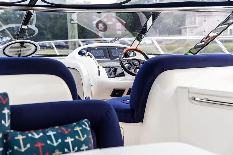 Slide: The Image of Interior of 1999 Sunseeker Camargue yacht with $250k in upgrades, featuring modern helm and seating. - 45