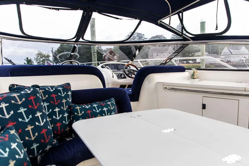 Slide: The Image of Interior of 1999 Sunseeker Camargue yacht with $250k in upgrades, featuring nautical-themed cushions. - 46