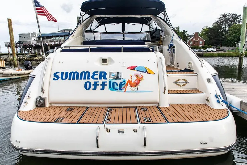 Slide: The Image of 1999 Sunseeker Carmargue yacht with $250k in upgrades, named Summer Office, docked at marina. - 6