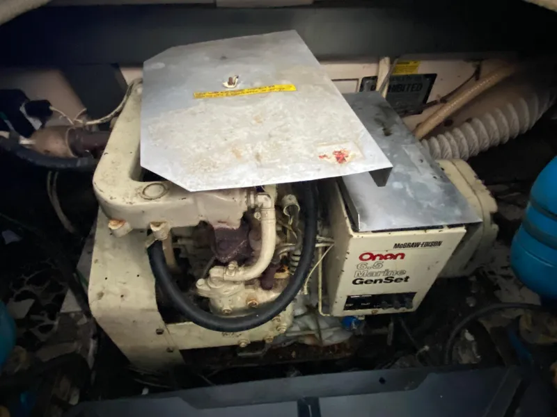 Slide: The Image of 1984 Trojan 10 Meter Sedan engine compartment with Onan Marine Genset. - 41