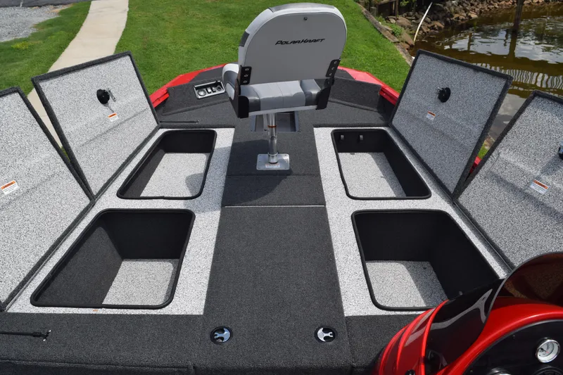 Slide: The Image of 2022 Polar Kraft Bass TX 195 Pro boat with open storage compartments and a central seat. - 14