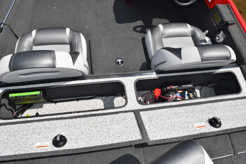 Slide: The Image of 2022 Polar Kraft Bass TX 195 Pro boat interior with storage compartments and seating. - 17