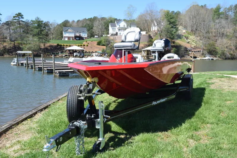 Slide: The Image of 2022 Polar Kraft Bass TX 195 Pro boat on trailer by lakeside. - 3