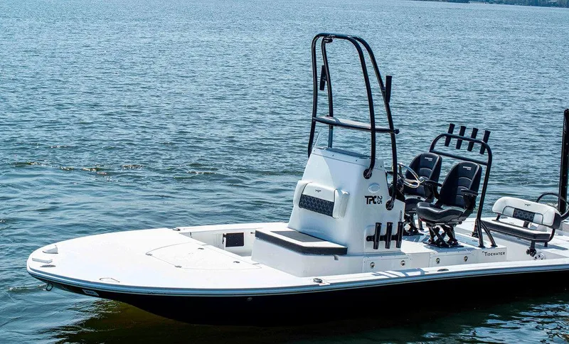 Slide: The Image of 2023 Tidewater 25 TPC Raptor boat on calm water. - 2