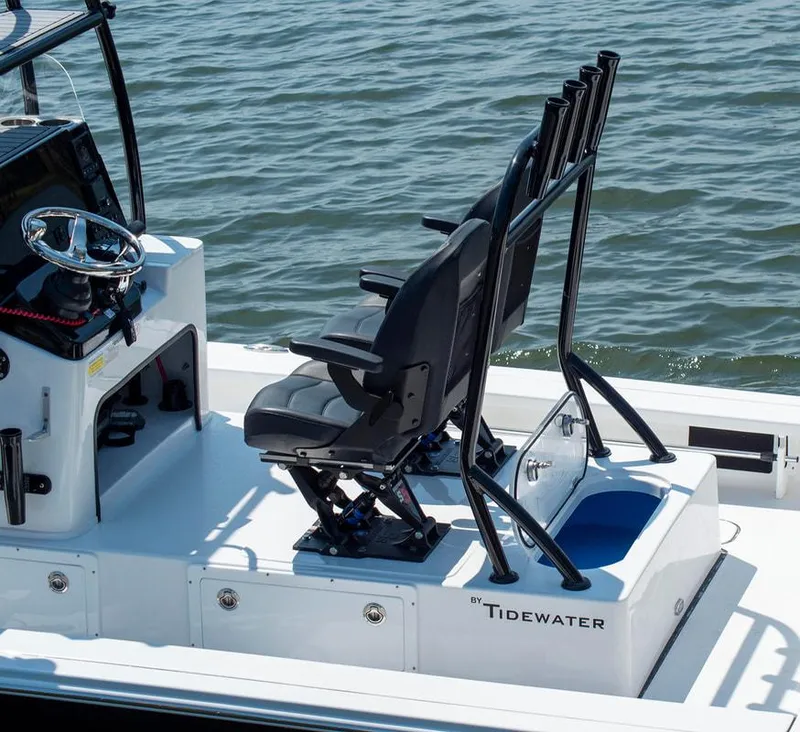 Slide: The Image of 2023 Tidewater 25 TPC Raptor boat interior with seating and steering wheel. - 4