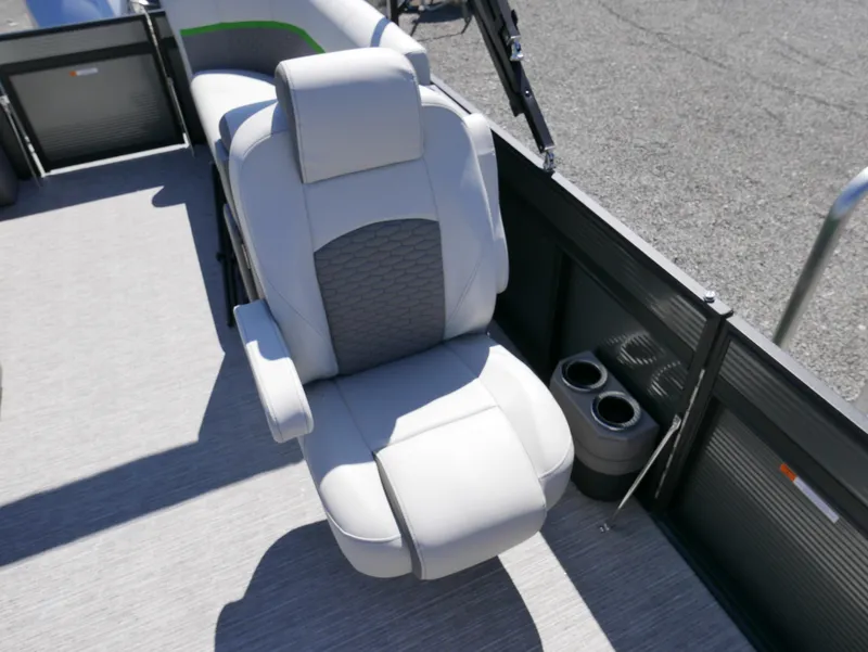 Slide: The Image of 2023 Qwest E-Class 822 RLS LTZ boat interior with luxury seating and cup holders. - 10