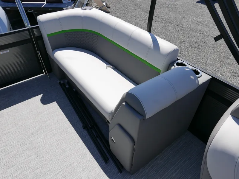 Slide: The Image of 2023 Qwest E-Class 822 RLS LTZ boat interior seating with gray and green accents. - 16