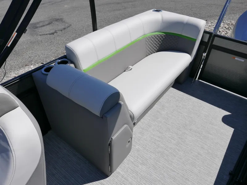 Slide: The Image of 2023 Qwest E-Class 822 RLS LTZ boat interior with gray and green seating. - 17