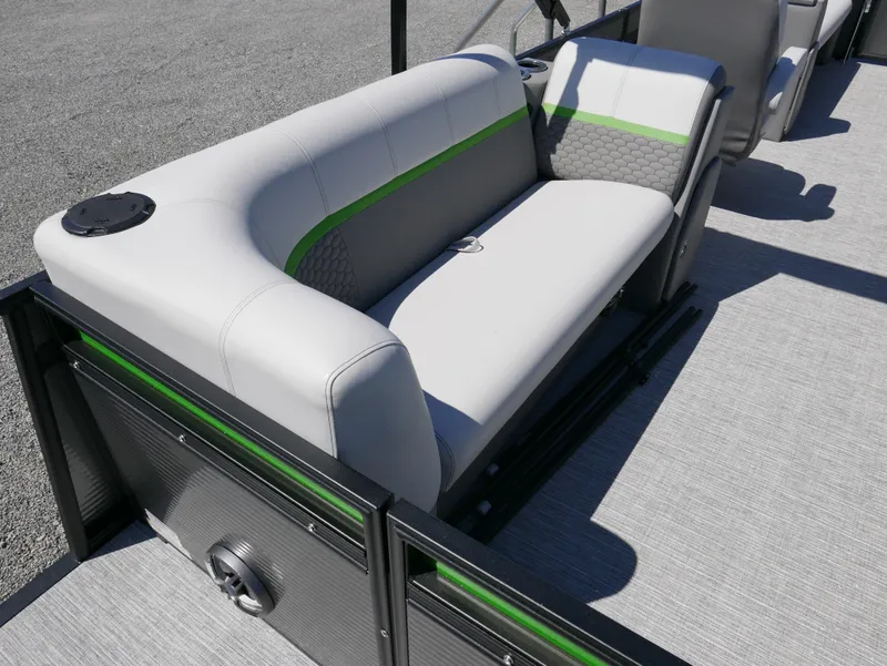Slide: The Image of 2023 Qwest E-Class 822 RLS LTZ boat interior with gray and green seating. - 18