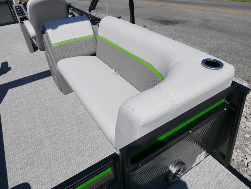 Slide: The Image of 2023 Qwest E-Class 822 RLS LTZ boat interior with gray and green seating. - 19