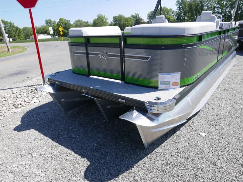 Slide: The Image of 2023 Qwest E-Class 822 RLS LTZ pontoon boat on gravel lot. - 2