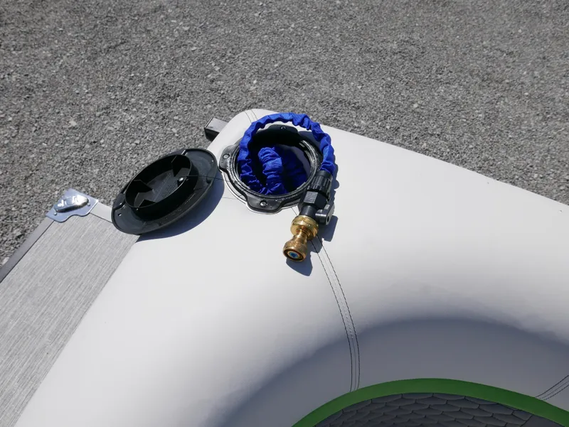 Slide: The Image of 2023 Qwest E-Class 822 RLS LTZ boat with hose and connector on deck. - 21